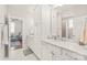 Elegant bathroom with double vanity, hexagon tile flooring, and pristine white cabinets at 5717 Closeburn Rd, Charlotte, NC 28210