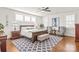 Elegant bedroom suite with neutral tones, a ceiling fan, plantation shutters, and stylish furnishings at 5717 Closeburn Rd, Charlotte, NC 28210
