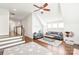 Inviting bonus room with hardwood floors, a ceiling fan, comfortable seating, and a cozy atmosphere at 5717 Closeburn Rd, Charlotte, NC 28210