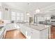 Spacious kitchen with a large island, white cabinets, and stainless steel appliances at 5717 Closeburn Rd, Charlotte, NC 28210