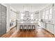 Bright eat-in kitchen features an island with seating, stainless steel appliances and custom cabinetry at 5717 Closeburn Rd, Charlotte, NC 28210