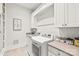 Well-lit laundry room with modern appliances, ample counter space, and stylish decor at 5717 Closeburn Rd, Charlotte, NC 28210