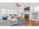 Bright living room with a fireplace, built-in shelving, and comfortable, stylish furniture at 5717 Closeburn Rd, Charlotte, NC 28210