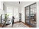 Bright office with a ceiling fan, plantation shutters on the windows, and stylish glass doors at 5717 Closeburn Rd, Charlotte, NC 28210