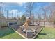 Backyard features a charming wooden playset with a slide and swing set surrounded by seating at 5717 Closeburn Rd, Charlotte, NC 28210