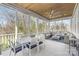 Inviting screened porch offers both dining and lounging areas with serene views at 5717 Closeburn Rd, Charlotte, NC 28210