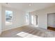 Bright bedroom with carpet flooring, large windows, and neutral paint, providing a serene space at 602 Banter Ln # 28, Cramerton, NC 28032