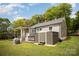A backyard showcasing a well-maintained lawn, hot tub, deck, and shed, providing ample outdoor space at 621 Bristol Dr, Statesville, NC 28677