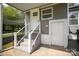 Backyard entrance to the home, featuring stairs and a white door at 621 Bristol Dr, Statesville, NC 28677