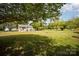 Expansive backyard featuring mature trees, a shed, and a detached garage, offering a serene outdoor retreat at 621 Bristol Dr, Statesville, NC 28677