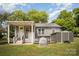 Exterior shot of home backyard, featuring a hot tub, storage shed, and covered porch at 621 Bristol Dr, Statesville, NC 28677