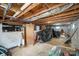 Unfinished basement with exposed ceiling, concrete floor, and visible utilities at 621 Bristol Dr, Statesville, NC 28677