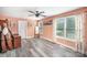 Peach colored bedroom with ceiling fan, natural light, and wood floors at 621 Bristol Dr, Statesville, NC 28677