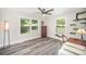 Spacious bedroom with hardwood floors, large windows, and modern ceiling fan at 621 Bristol Dr, Statesville, NC 28677