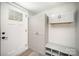 Clean entryway with a white front door, storage cabinets, and a shoe rack at 621 Bristol Dr, Statesville, NC 28677