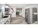Modern kitchen with stainless appliances, granite countertops and white cabinets at 621 Bristol Dr, Statesville, NC 28677