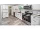 Modern kitchen with stainless appliances, sleek countertops and white cabinets at 621 Bristol Dr, Statesville, NC 28677