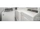 Well-lit laundry area with modern, white, Whirlpool washer and dryer units at 621 Bristol Dr, Statesville, NC 28677