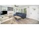 Bright living room featuring modern decor, ceiling fan and lots of natural light at 621 Bristol Dr, Statesville, NC 28677