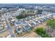 Aerial view of the neighborhood showcases homes, a pond and woods, and the layout of the community at 634 Gants Rd, York, SC 29745