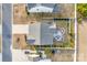 Aerial view of a home showcasing the backyard patio, fire pit, manicured lawn, and driveway at 634 Gants Rd, York, SC 29745