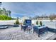 Beautiful backyard features an outdoor seating area, a built-in grill, a fire pit, and a white fence at 634 Gants Rd, York, SC 29745