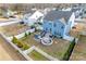 Aerial view of the backyard with a fire pit, patio, and green grass at 634 Gants Rd, York, SC 29745