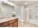 Well-lit bathroom features a single sink vanity and a shower over tub with neutral colored flooring at 634 Gants Rd, York, SC 29745