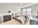 Cozy bedroom with plush carpeting, neutral decor, and plenty of natural light from the window at 634 Gants Rd, York, SC 29745