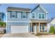 Charming home with brick and siding facade, manicured lawn, and two-car garage at 634 Gants Rd, York, SC 29745