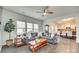 Cozy living room featuring a comfortable sectional sofa, large windows, and hardwood floors at 634 Gants Rd, York, SC 29745