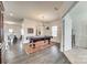 Bright living room featuring a pool table, wood flooring, and a contemporary chandelier at 634 Gants Rd, York, SC 29745