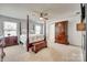 Spacious main bedroom with four poster bed, armoire, and neutral colors at 634 Gants Rd, York, SC 29745