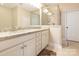 Bathroom features dual sinks, granite countertops, white cabinets, and a glass-enclosed shower at 8418 Loxton Cir, Charlotte, NC 28214
