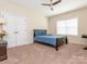 Bedroom with neutral walls and carpet, ample natural light, and a closet at 8418 Loxton Cir, Charlotte, NC 28214