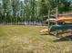 Lawn area with kayak storage racks and a view of the lake in a scenic setting at 8418 Loxton Cir, Charlotte, NC 28214