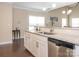 Kitchen featuring stainless steel appliances, granite countertops, white cabinets, and a stylish subway tile backsplash at 8418 Loxton Cir, Charlotte, NC 28214