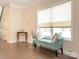 Bright living room featuring a large window, hardwood floors, and comfortable seating at 8418 Loxton Cir, Charlotte, NC 28214