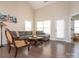 Inviting living room with hardwood floors, a comfortable sectional sofa, and ample natural light at 8418 Loxton Cir, Charlotte, NC 28214