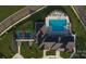 Stunning aerial view of the community pool, tennis courts and upscale clubhouse at 9432 Liberty Hill Dr, Mint Hill, NC 28227