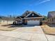 Beautiful home featuring a brick facade, two-car garage, and well-manicured lawn at 9432 Liberty Hill Dr, Mint Hill, NC 28227