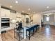 Modern kitchen with stainless steel appliances, a large island with seating, and pendant lighting at 9432 Liberty Hill Dr, Mint Hill, NC 28227