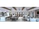 Spacious living space featuring beamed ceilings, a fireplace, bar seating, and modern finishes at 9432 Liberty Hill Dr, Mint Hill, NC 28227