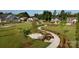 Beautiful neighborhood featuring sidewalks, benches, landscaping and green space at 9432 Liberty Hill Dr, Mint Hill, NC 28227