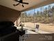 Screened patio with a comfortable seating area overlooking a spacious backyard at 9432 Liberty Hill Dr, Mint Hill, NC 28227