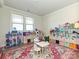 Bright playroom with a variety of toys and a colorful rug at 9432 Liberty Hill Dr, Mint Hill, NC 28227