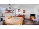 Spacious bedroom with wood-look floors, bright window and a large dresser at 10316 Stineway Ct, Pineville, NC 28134
