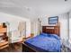 Spacious bedroom with dark hardwood floors, neutral walls, and ample natural light at 10316 Stineway Ct, Pineville, NC 28134