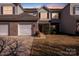 Charming two-story townhouse featuring an attached garage and well-maintained landscaping at 10316 Stineway Ct, Pineville, NC 28134