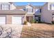 Charming two-story townhouse featuring an attached garage and well-maintained landscaping at 10316 Stineway Ct, Pineville, NC 28134